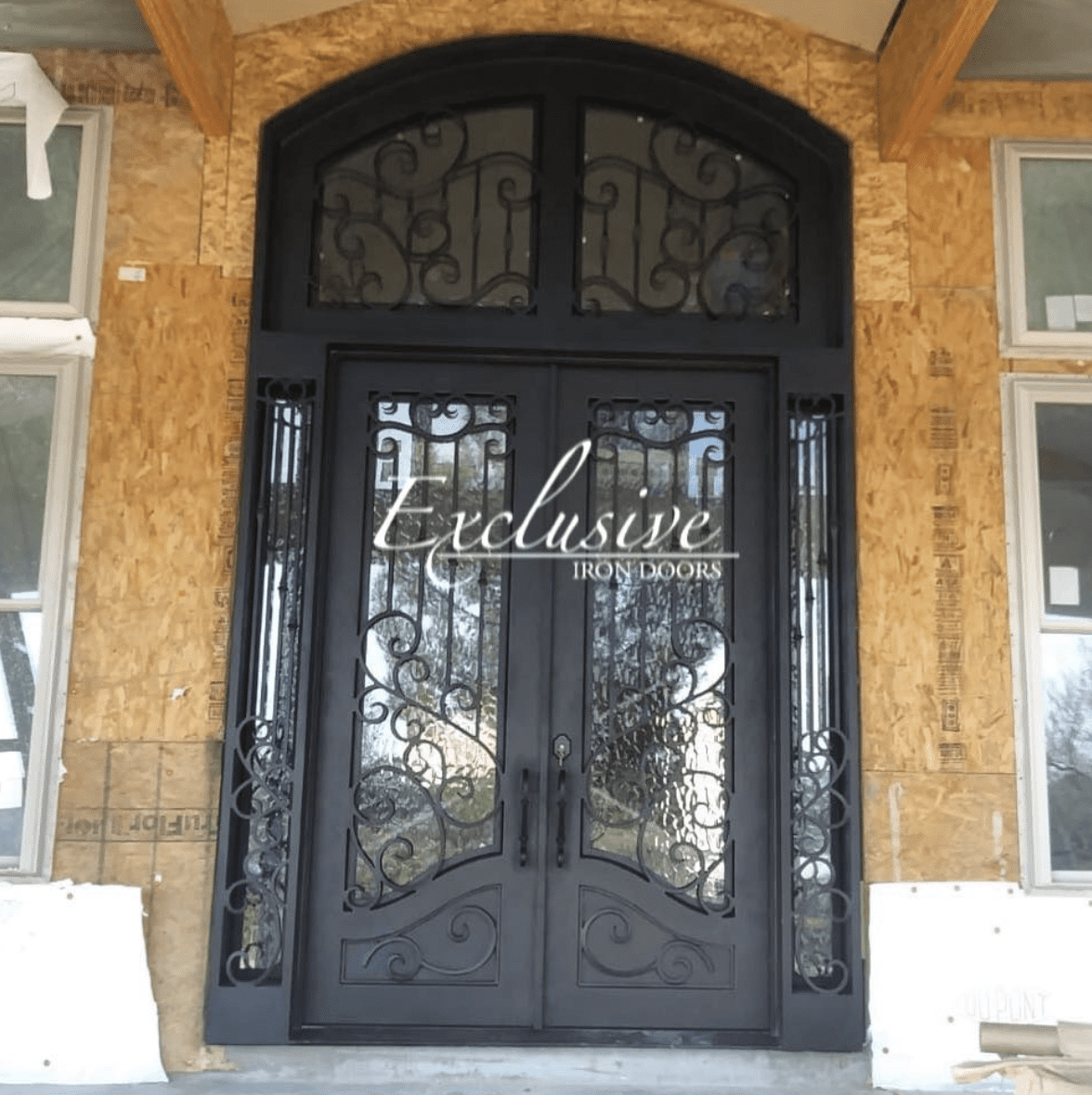 Custom wrought 205 double with transom and sidelights