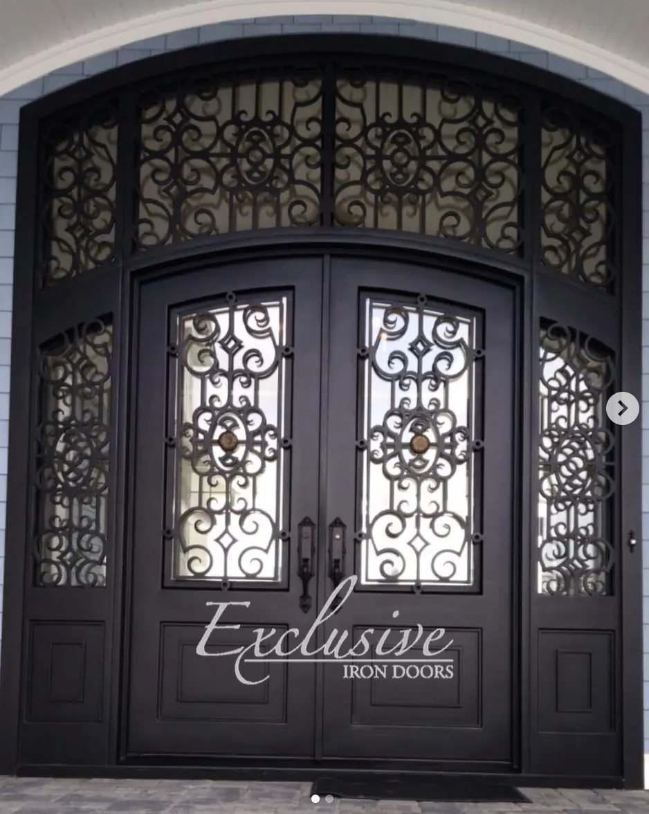 Custom wrought 305 double with sidelights and transom eyebrow